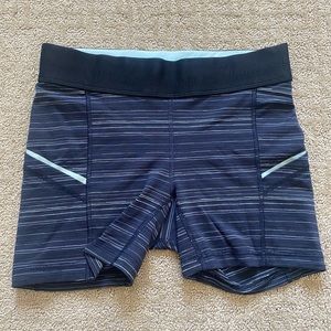 Lululemon shorts, navy and stripes with black band around waist. Size small.